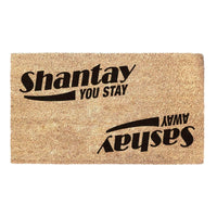 Thumbnail for Coir doormat with RuPaul saying 'Shantay you stay, Sashay Away' printed on in it with black ink