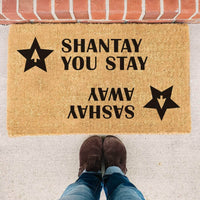 Thumbnail for Coir doormat with two stars and a RuPaul saying 'Shantay you stay, Sashay Away' printed on in it with black ink