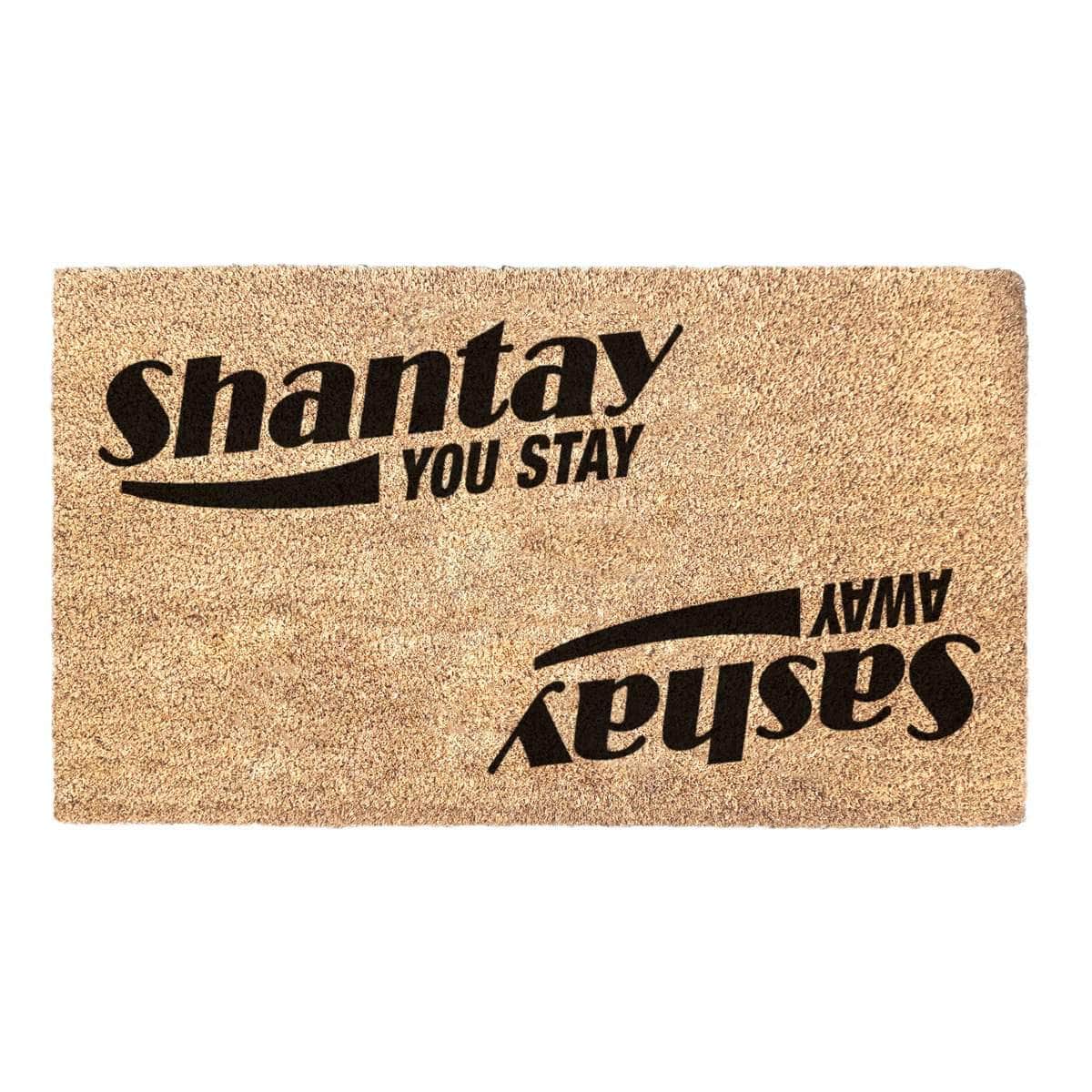 Coir doormat with RuPaul saying 'Shantay you stay, Sashay Away' printed on in it with black ink