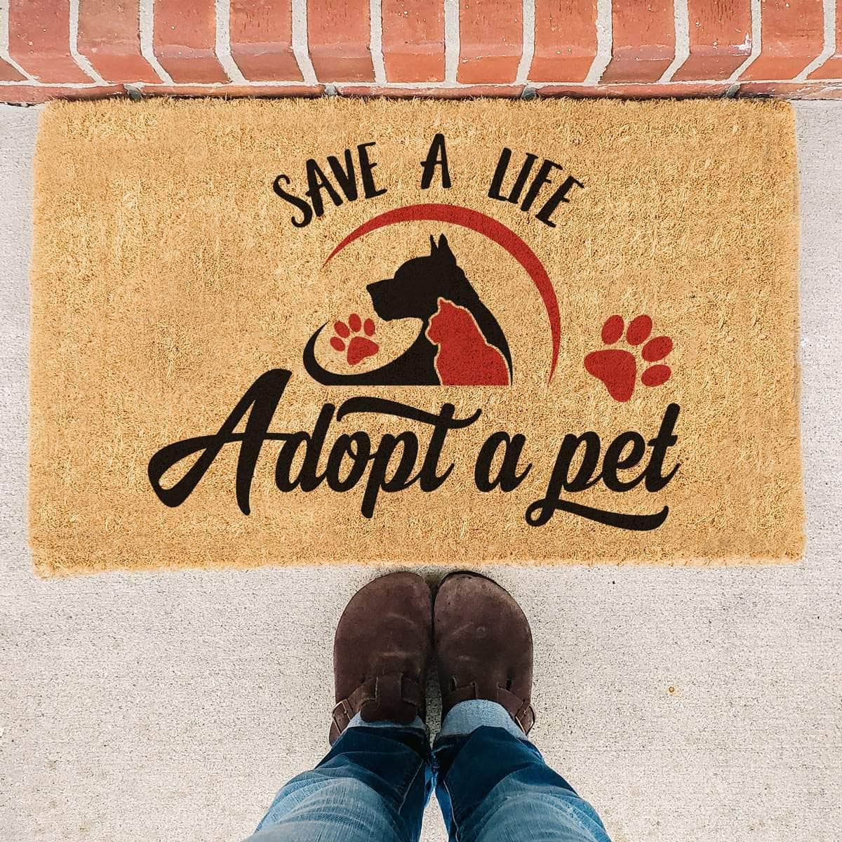 Welcome mat with cat and dog on it. 
